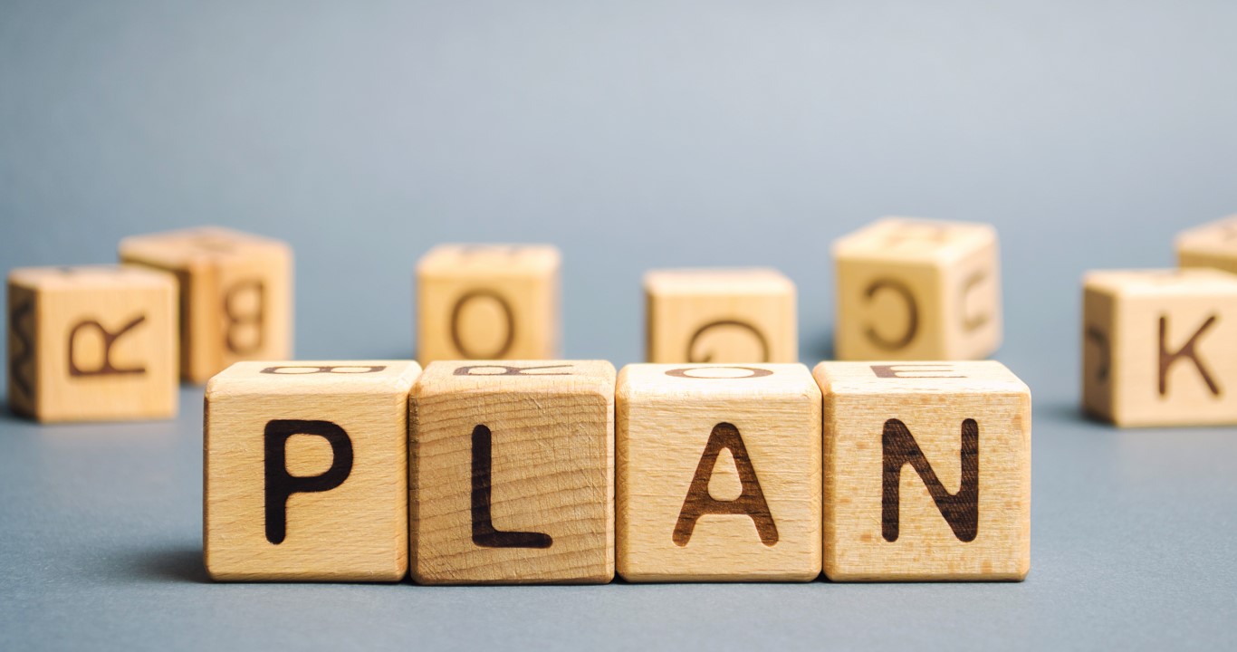 Wooden blocks with the word Plan. Strategy planning. Management business concept.